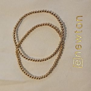 Pair of Enewton classic size gold 3mm bead bracelets